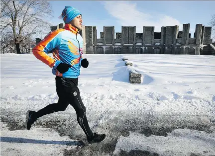  ?? JOHN MAHONEY ?? Elite triathlete Mohamad Alsabbagh runs along Rene Levesque Blvd. in Montreal. The Syrian athlete now living in Canada is worried that Donald Trump’s travel ban could prevent him from competing in races in the U.S. and hurt his chances of qualifying...