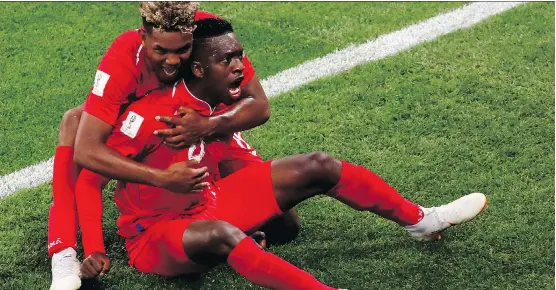  ?? JACK GUEZ/AFP/GETTY IMAGES ?? Panama was never going to win, but Ricardo Avila and Jose Luis Rodriguez still found a positive this week with their country’s first goal in World Cup history.