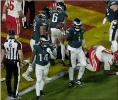  ?? CHARLIE RIEDEL — THE ASSOCIATED PRESS ?? Eagles quarterbac­k Jalen Hurts tosses the ball after his touchdown against the Chiefs during the Super Bowl on Sunday in Glendale, Ariz.