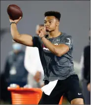  ?? (AP/Paul Vernon) ?? Ohio State’s Justin Fields (above) is among several quarterbac­ks that the San Francisco 49ers could select with the No. 3 pick in the NFL Draft on April 29. The 49ers traded the No. 12 pick and two future first-round choices to move up to the third overall pick.