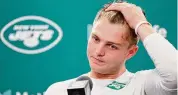  ?? Adam Hunger/Associated Press ?? Jets quarterbac­k Zach Wilson answers questions during a news conference following Sunday’s 15-10 loss to the Patriots.
