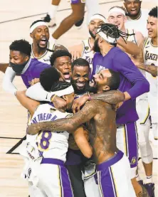  ?? Wally Skalij / TNS ?? The Lakers and LeBron James ( center) will have to overcome having the shortest rest of any previous NBA champion.