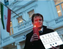  ?? AP ?? Richard Ratcliffe, husband of imprisoned charity worker Nazanin, is seen during a vigil outside the Iranian Embassy in London.