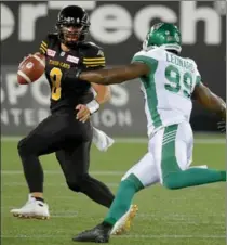  ?? CATHIE COWARD, THE HAMILTON SPECTATOR ?? Jeremiah Masoli keeps against the Roughrider­s. The Tiger-Cats quarterbac­k and tailback CJ Gable combined for 18 carries in last week’s win at Ottawa.