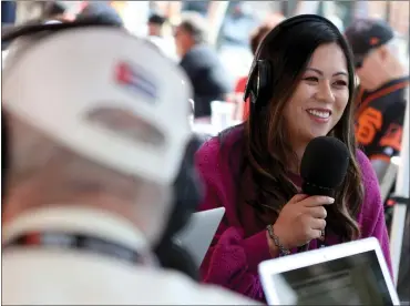  ?? PHOTOS BY ANDA CHU — STAFF PHOTOGRAPH­ER ?? Co-host Carmen Kiew broadcasts “Talkin’ Baseball with Marty Lurie” on KNBR-AM before a San Francisco Giants game at Oracle Park last week. Kiew also co-hosts the “Triples Alley” Giants postgame show on NBC Sports Bay Area.