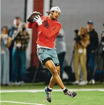  ?? Paul Vernon/Associated Press ?? Ohio State receiver Jaxon Smith-Njigba runs a drill at the school’s NFL Pro Day in Columbus, Ohio, on Wednesday. Due to injury, he played only three games during the 2022 season.