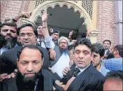  ?? REUTERS ?? Hafiz Saeed (centre) reacts to supporters after his release from house arrest in Lahore, Pakistan, last month.