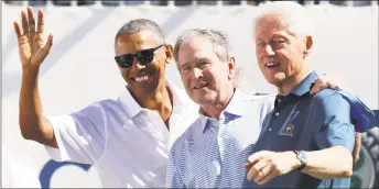  ?? Rob Carr ?? Former Presidents Barack Obama, George W. Bush and Bill Clinton attend the trophy presentati­on prior to Thursday foursome matches of the Presidents Cup in Jersey City, N.J.