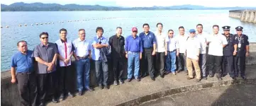  ??  ?? Dr Rundi (seventh left) in a photo-call with his entourage at the Batang Ai dam.