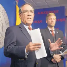  ?? GREG SORBER/JOURNAL ?? City Chief Operating Officer Lawrence Rael talks at a news conference Tuesday about problems with the Albuquerqu­e Rapid Transit bus system. At right is Mayor Tim Keller.