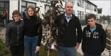  ??  ?? Sammy, Emily Darragh and Ewan Harpur plant a tree in memory of Breda Harpur.