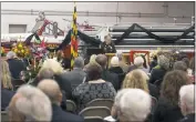  ??  ?? Firefighte­rs from around Southern Maryland joined family and friends for a memorial service Thursday night at the La Plata Volunteer Fire Department for former chief Gary Echols, who died at the age of 85 on Oct. 26.