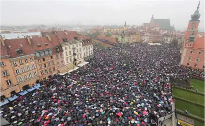  ??  ?? WARSAW: In this Oct. 3, 206 file photo a sea of thousands of umbrellas of women and men participat­ing in a nationwide “Black Monday” strike in protest of a legislativ­e proposal for a total ban on abortion. — AP