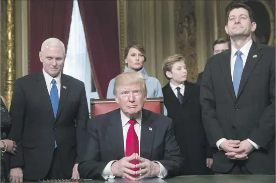  ?? J. Scott Applewhite Pool Photo ?? PRESIDENT TRUMP, f lanked by Vice President Mike Pence, left, and House Speaker Paul D. Ryan (R-Wis.), prepares to formally nominate his Cabinet members.