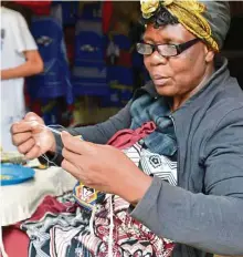  ??  ?? An artisan at work at the Ezulwini Craft Market.