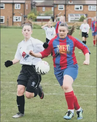  ??  ?? CHALLENGIN­G: That’s Louise Burgess (right) for Peterborou­gh Northern Star Reserves against Cambridge City. Picture: TIM GATES