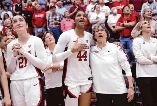  ?? Scott Strazzante/The Chronicle ?? Stanford’s Brooke Demetre, Kiki Iriafen and VanDerveer watch on a scoreboard screen as Utah defeats USC, giving the Cardinal a share of the 2024 conference championsh­ip.