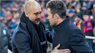  ?? — AP ?? Pep Guardiola greets Basel coach Raphael Wicky before their Champions League match.