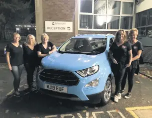  ??  ?? What Women Want group members (from left) Elaine Burgess, Jo Millward, Jayne Carter, Jill Harding and Julie Barnes with the car used for East Cheshire Hospice @Home.