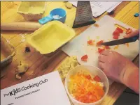  ??  ?? Getting kids involved in the kitchen allows them to learn about different food textures and tastes.