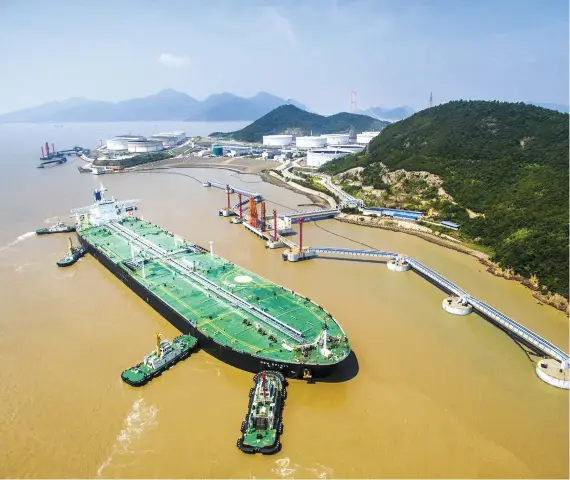  ?? Oman crude oil arrives at the Zhoushan port in Zhejiang, China. A cooling of the global economy will reduce demand for oil, experts say. ??