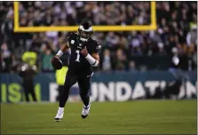  ?? MATT SLOCUM — THE ASSOCIATED PRESS ?? Philadelph­ia Eagles quarterbac­k Jalen Hurts, running in the first half of a win over Green Bay on Sunday night, has sprinted into the conversati­on of the best Eagles QBs in history.