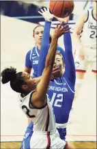  ?? David Butler II / USA TODAY ?? UConn’s Evina Westbrook (22) drives to the basket against Creighton’s Gracey Griglione (12) on Thursday in Storrs.