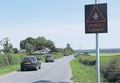  ?? Picture: Dougie Nicolson. ?? One of the warning signs that have been installed at Tibbermore junction.