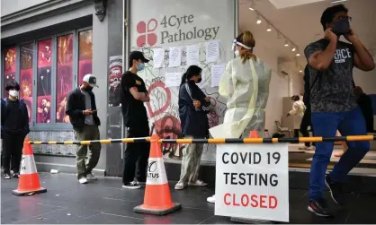  ?? Photograph: Joel Carrett/AAP ?? People queue at a Covid testing site in Melbourne. Loosened close-contact rules have made it easier to keep people at work but the extra capacity has been overwhelme­d by surging case numbers, which passed 68,000 nationally on Thursday.