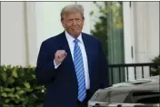  ?? LYNNE SLADKY — THE ASSOCIATED PRESS ?? Former President Donald Trump pumps his fist as he arrives for a GOP fundraiser on Saturday in Palm Beach, Fla.