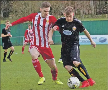  ?? Photograph: Phil Harman. ?? Graeme Rodger, Formartine, and Fort’s Jordan Morrison tussle for the ball.