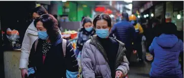  ?? Foto Aly Song/Reuters ?? V Wuhanu so virus odkrili konec leta 2019, od takrat so oči strokovnja­kov WHO uperjene vanj.