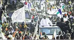  ?? CARL DE SOUZA/AFP ?? Gambia’s new president Adama Barrow leaves Banjul airport on Thursday in Banjul, Gambia, after returning from Senegal.