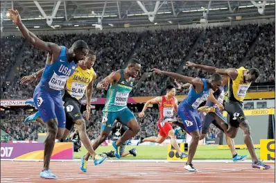  ?? AP/MATT DUNHAM ?? American Justin Gatlin (above, far left) defeats Jamaica’s Usain Bolt (far right) in the 100-meter final, then bows down to the eighttime Olympic gold medalist Saturday at the Track and Field World Championsh­ips in London. The 100-meter race was the...