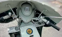  ??  ?? A good view of all the controls; the ignition switch is on the far right. The police were appreciati­ve of the full fairing in winter months. A small glove box on the top of the frame is useful