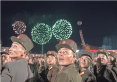  ??  ?? Korean People’s Army soldiers watch fireworks last week at a celebratio­n for scientists involved in North Korea’s latest nuclear blast.