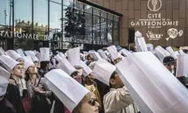  ?? Pictures: AFP ?? CAN’T WAIT. People wait to enter on the opening day of the internatio­nal Gastronomy and Wine centre in Dijon, Eastern France.