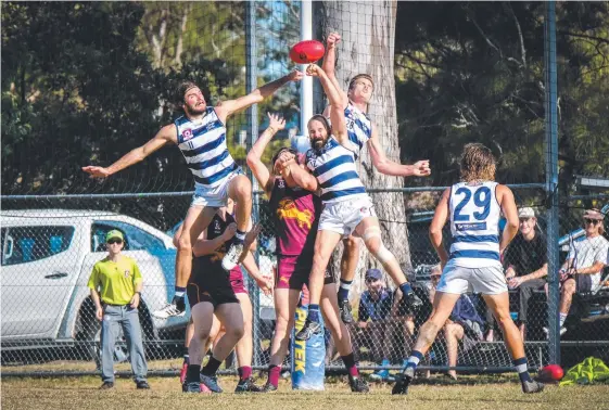  ?? Picture: MICHAEL SELSBY ?? Palm Beach Currumbin’s Brayden Crossley is sandwiched between Broadbeach players (from left) Sam Weddell, Josh Searl and James Royes.