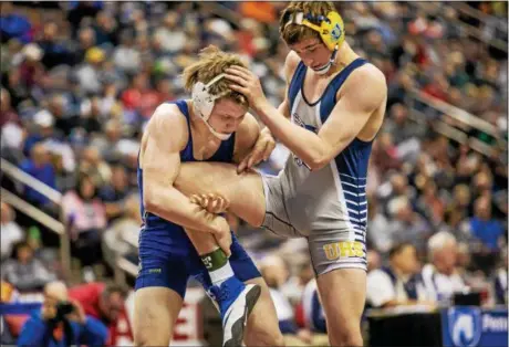  ?? NATE HECKENBERG­ER — FOR DIGITAL FIRST MEDIA ?? Downingtow­n West’s Max Hale lifts Unionville’s Tyler Mousaw during a 4-3 win in the fourth round of consolatio­ns at 170 pounds. Hale took sixth while Mousaw finished eighth.
