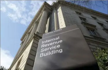  ?? SUSAN WALSH — THE ASSOCIATED PRESS FILE ?? In this file photo, the exterior of the Internal Revenue Service (IRS) building in Washington. When Republican­s say they want to lower income tax rates and get rid of loopholes to make up the lost revenue, they’re talking about eliminatin­g some very...