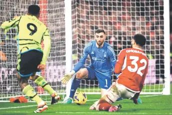  ?? — AFP photo ?? Arsenal’s striker Jesus (left) scores his team first goal during the English Premier League match against Nottingham Forest at The City Ground in Nottingham, central England.