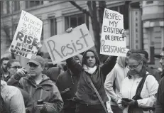  ?? OLIVIER DOULIERY/ABACA PRESS ?? Protesters block K street during the inaugurati­on of President Donald Trump on Friday in Washington, D.C.