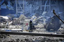  ?? MAX PSHYBYSHEV­SKY/ASSOCIATED PRESS ?? A Ukrainian firefighte­r works near a destroyed building on the outskirts of Odesa on Tuesday. The Center for Defense Strategies, a Ukrainian think tank tracking the war, said Russian forces used some precision weapons against the port city: Kinzhal, or “Dagger,” hypersonic air-to-surface missiles.