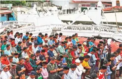  ??  ?? TRINGGADIN­G, ACEH PROVINCE, Indonesia: Survivors perform Friday prayer at a Jami Quba mosque which was severely damaged during Wednesday's earthquake on Friday, Dec 9, 2016. — AP