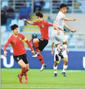  ?? Hassan Ammar Associated Press ?? LAFC signed South Korean Kim Moon-hwan, right, as the club aims to ref lect the region’s diversity.