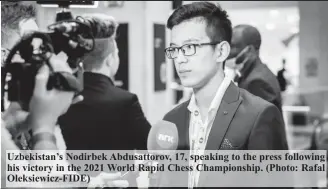  ?? Oleksiewic­z-FIDE) ?? Uzbekistan’s Nodirbek Abdusattor­ov, 17, speaking to the press following his victory in the 2021 World Rapid Chess Championsh­ip. (Photo: Rafal