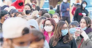  ?? RINGO H.W. CHIU/AP ?? Black Friday shoppers wait in line to enter a store at the Citadel Outlets in Commerce, California.