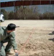  ?? THE ASSOCIATED PRESS ?? In this April 14, 2016, file photo provided by U.S. Customs and Border Protection, a Border Patrol agent shows the path of a tunnel that crosses the U.S.-Mexico border near Calexico, Calif.