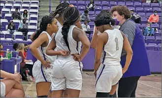  ?? Tony Burns/News-Times ?? Huddle: El Dorado’s girls basketball team discusses strategy during their game against Camden Fairview at Wildcat Arena earlier this season. The Lady Wildcats fell to Maumelle on Tuesday and face Little Rock Parkview tonight.