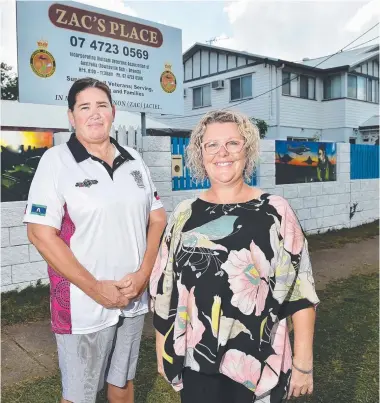  ?? Ment officer with Townsville North Youth Justice Service Centre Kerrie Smallwood and project manager of the ac’s Place, where three military murals have been added to the front fence. Picture: SHAE BEPLATE ??